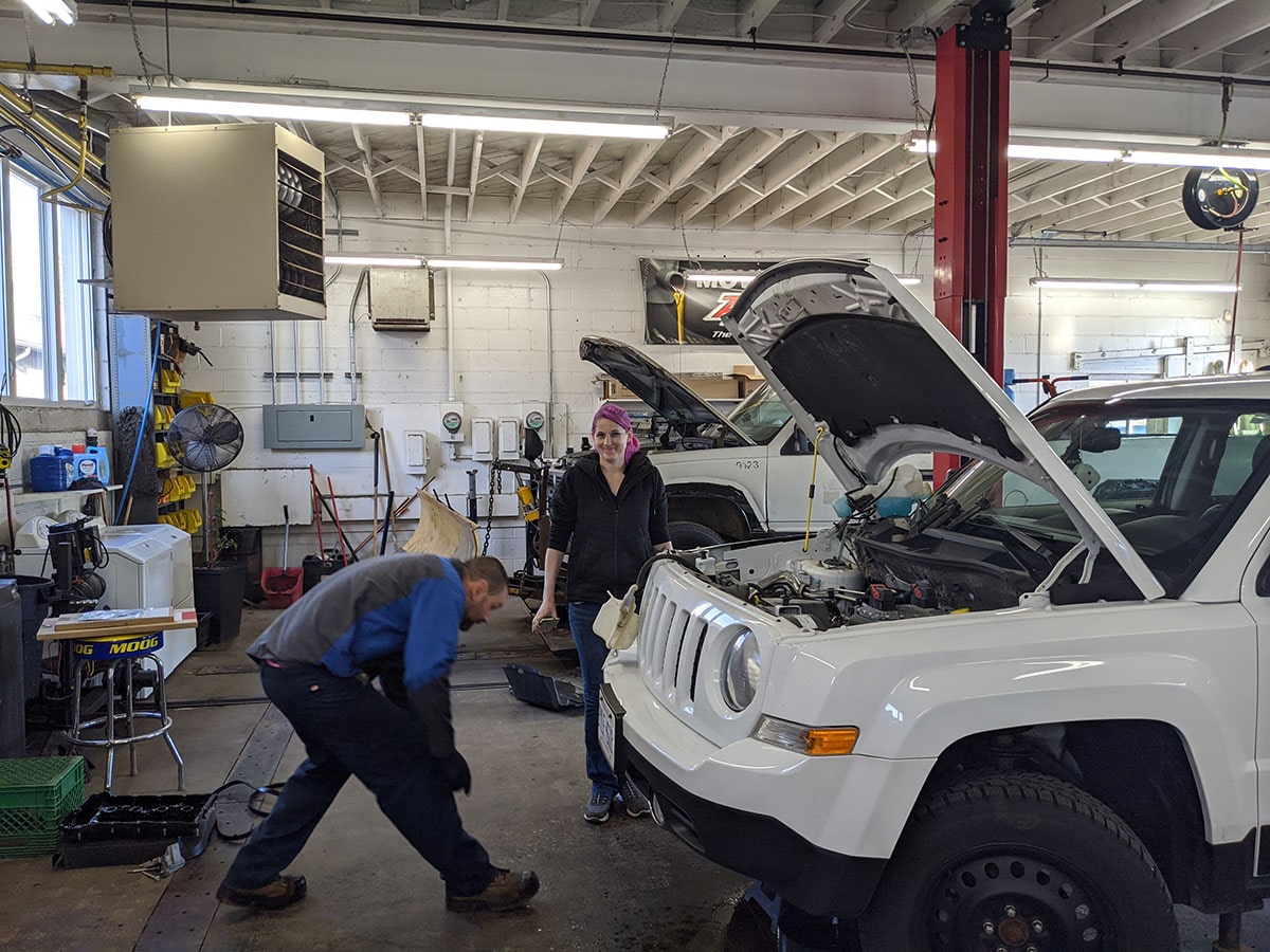 technicians at work at the auto station ca